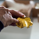 An investigator showing off one of the many items found in the gold hoard.